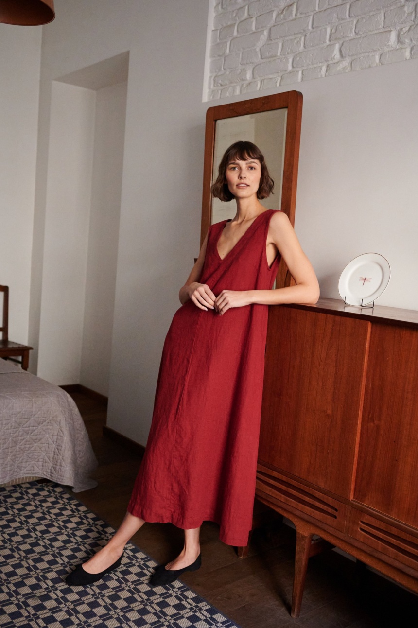 women is wearing sleeveless maxi linen dress in red color