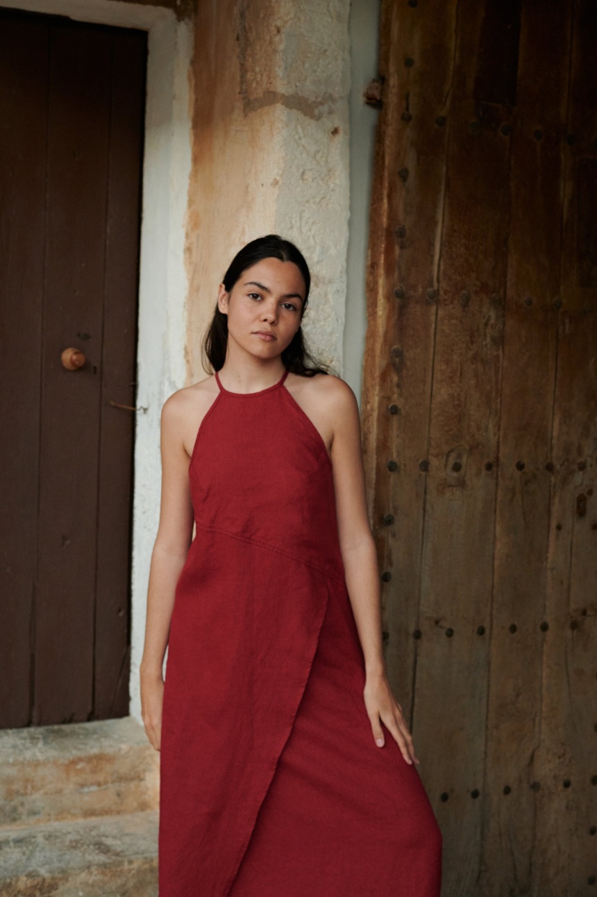 Halter neck maxi dress with open shoulders and asymmetric skirt