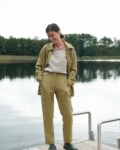 Heavy linen utility jacket and trousers outfit with a tucked in linen shirt