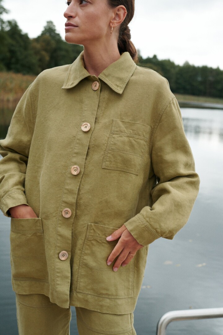 Olive linen chore jacket with patch pockets and button front