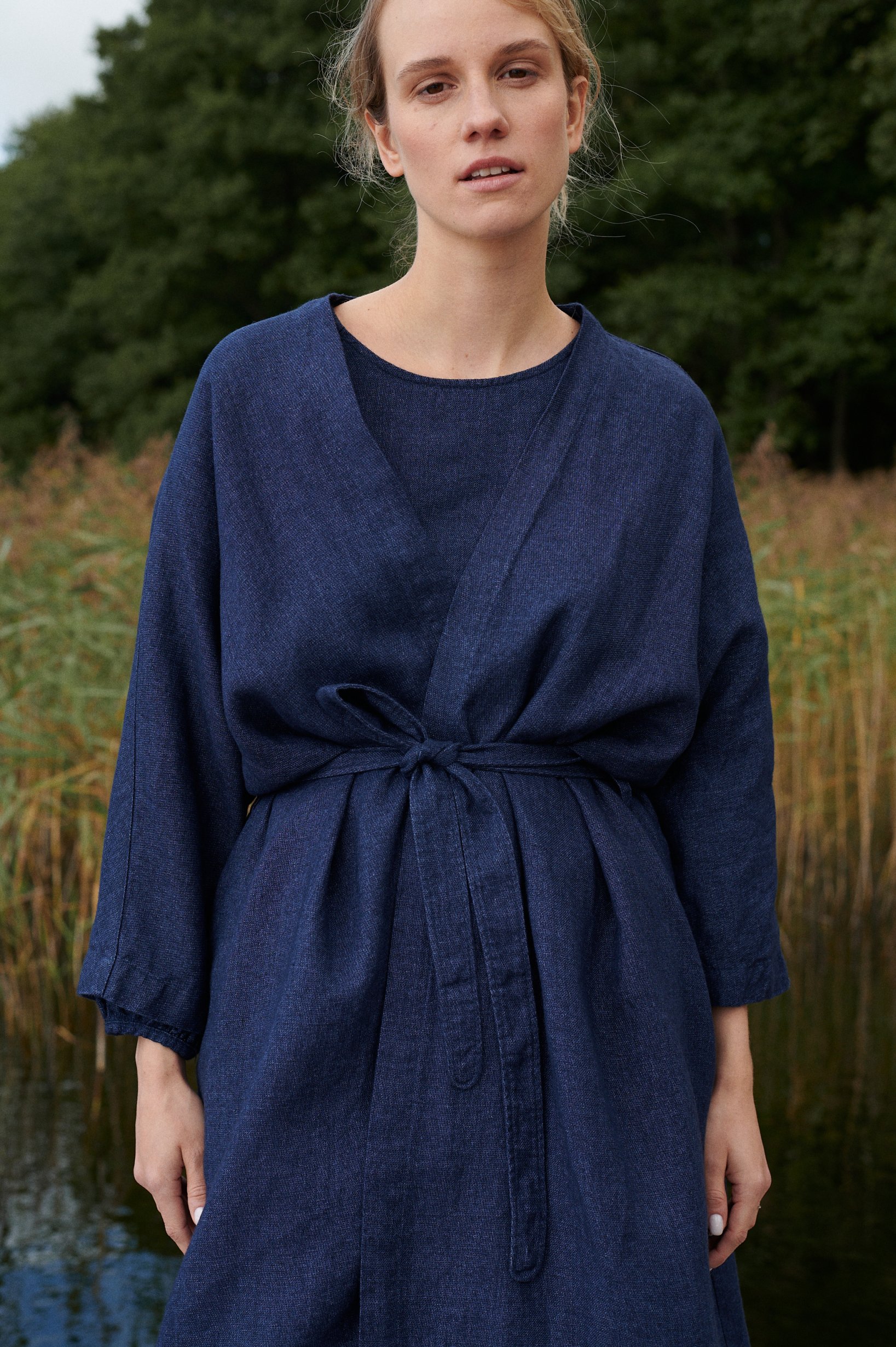 woman wearing linen and wool blend jacket, linen dress, autumn and winter linens.