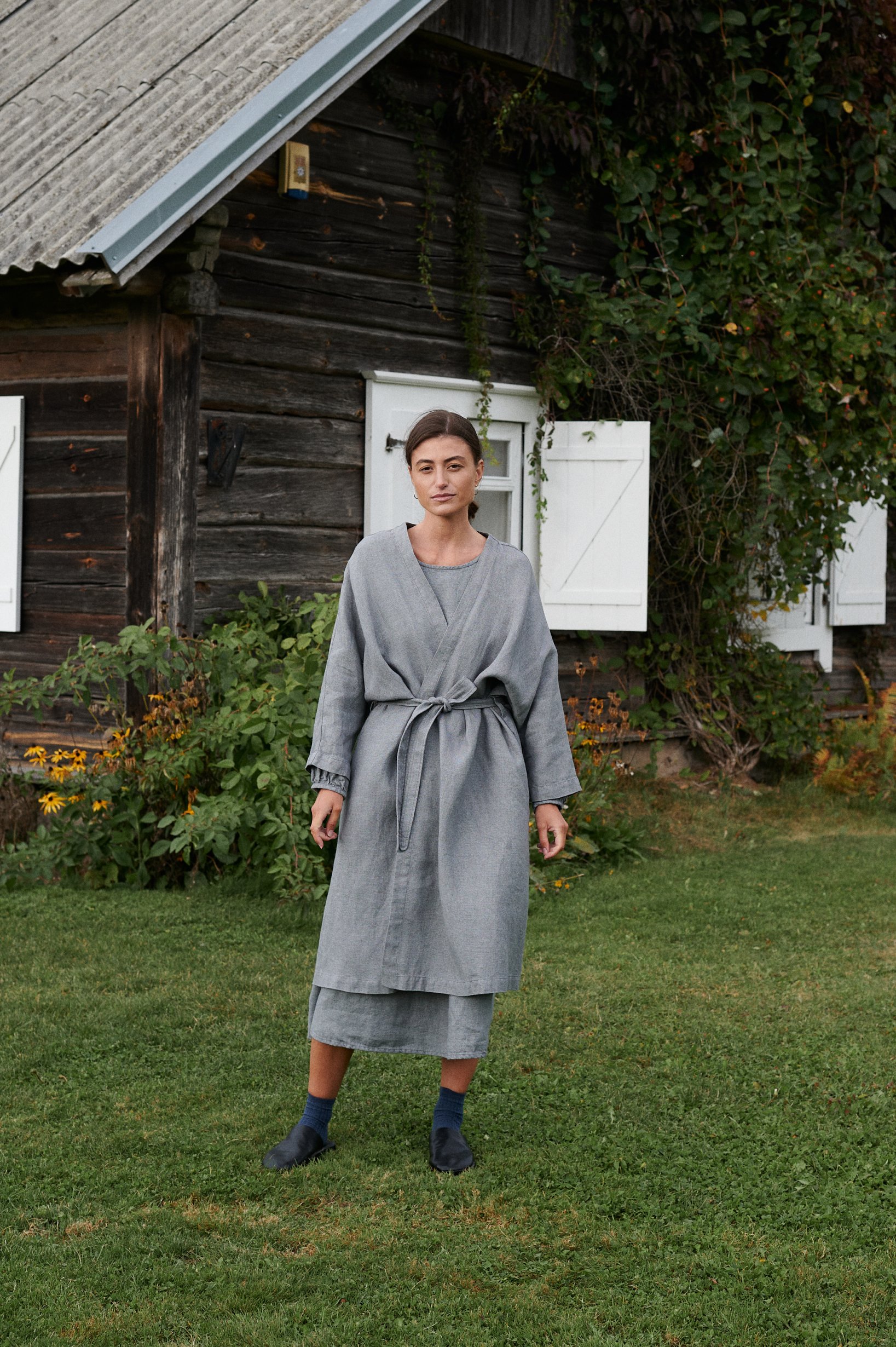 woman wearing linen and wool blend jacket, linen dress, autumn and winter linens.