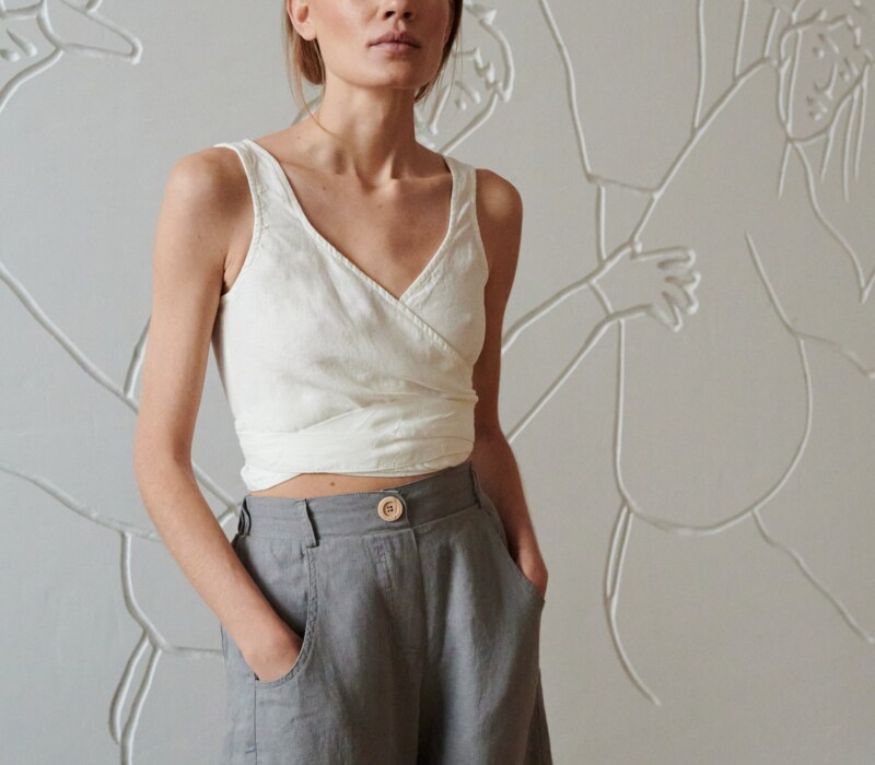 wide leg grey linen trousers with decorative button and pockets