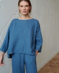 A blue oversized linen top with a high-low hem