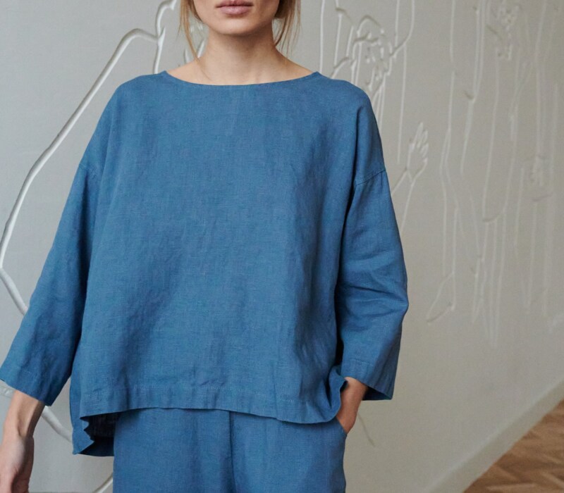 A blue oversized linen top with a high-low hem