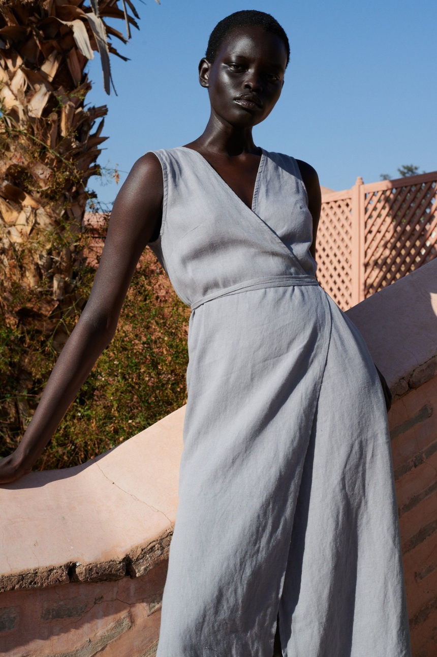 model wearing linen wrap midi dress