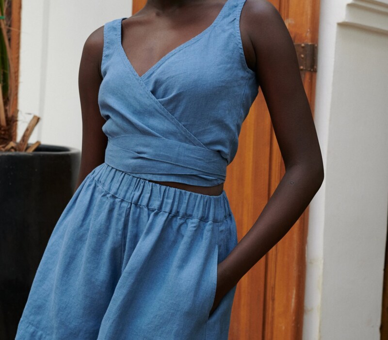 women wearing wide leg blue linen shorts