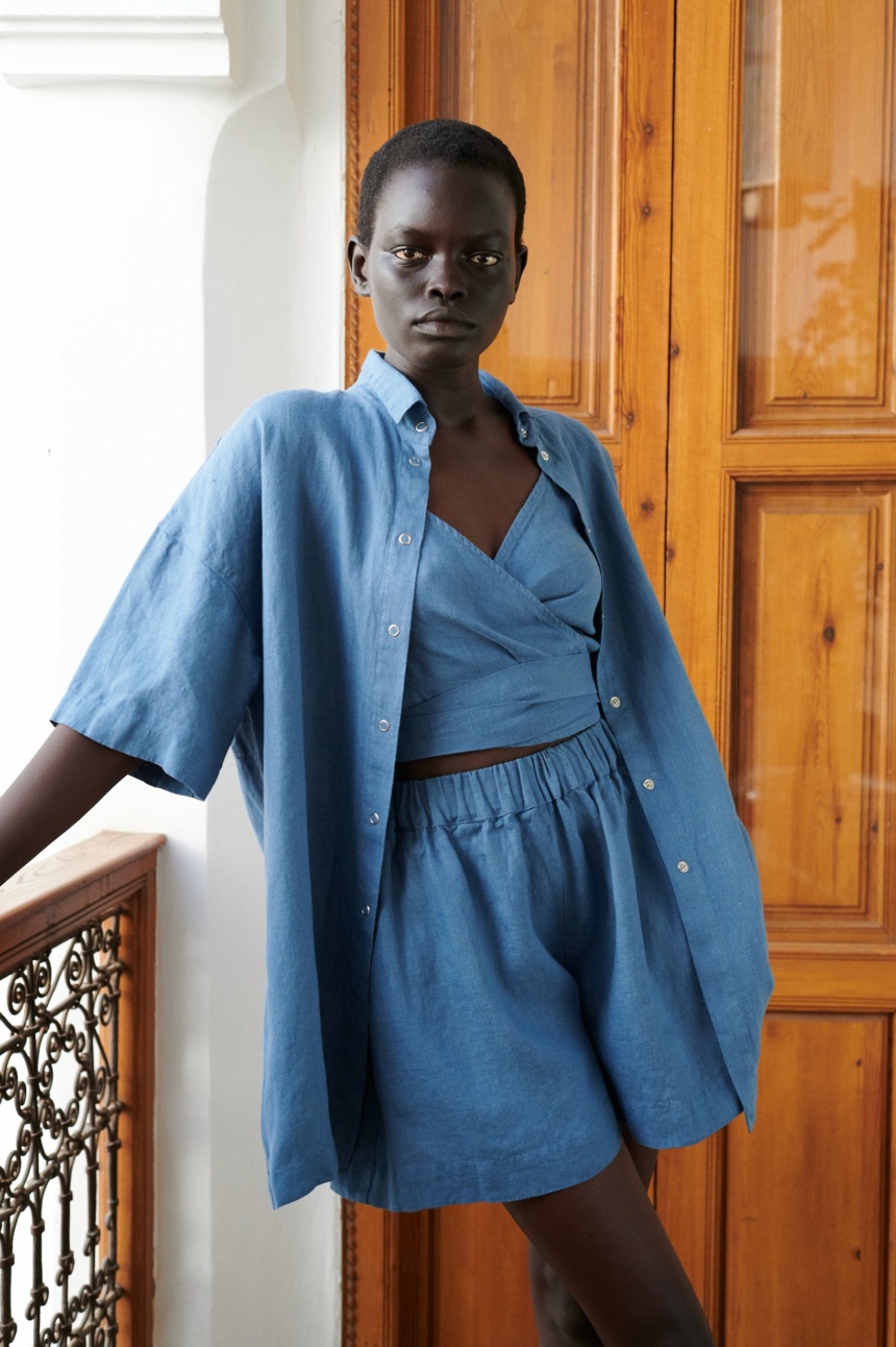 Blue linen shirt with oversized fit and longline silhouette