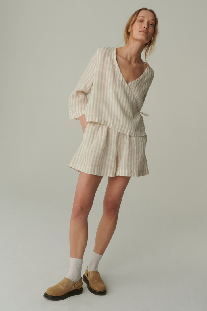 model is wearing linen shorts for women