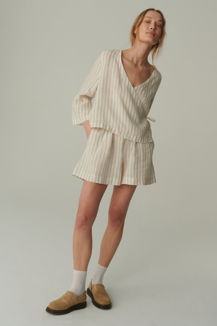 model is wearing linen shorts for women