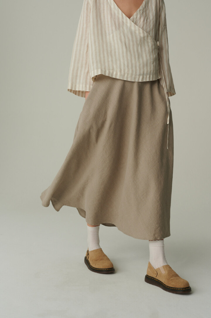 women is wearing long summer skirt in natural grey color