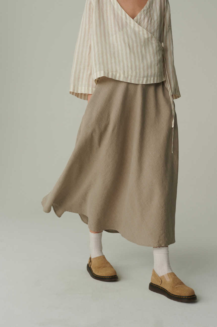 women is wearing long summer skirt in natural grey color