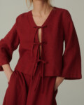 model is wearing red tie front top