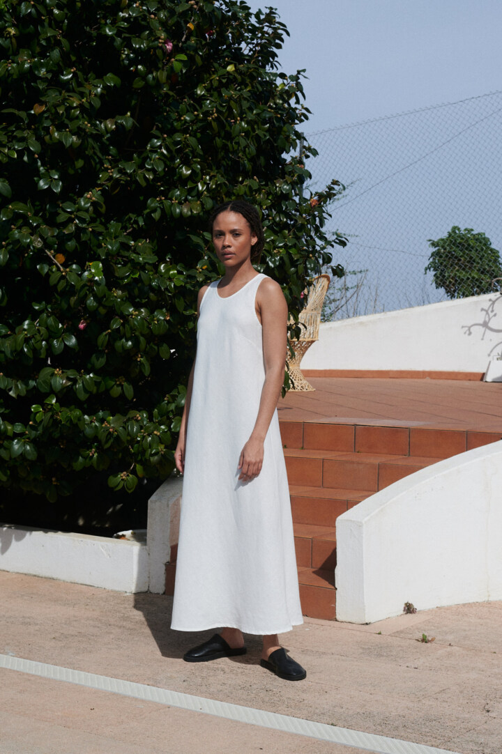Women is wearing white bias cut dress