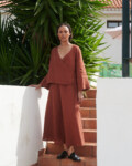 women is wearing summer linen skirt in terracotta color