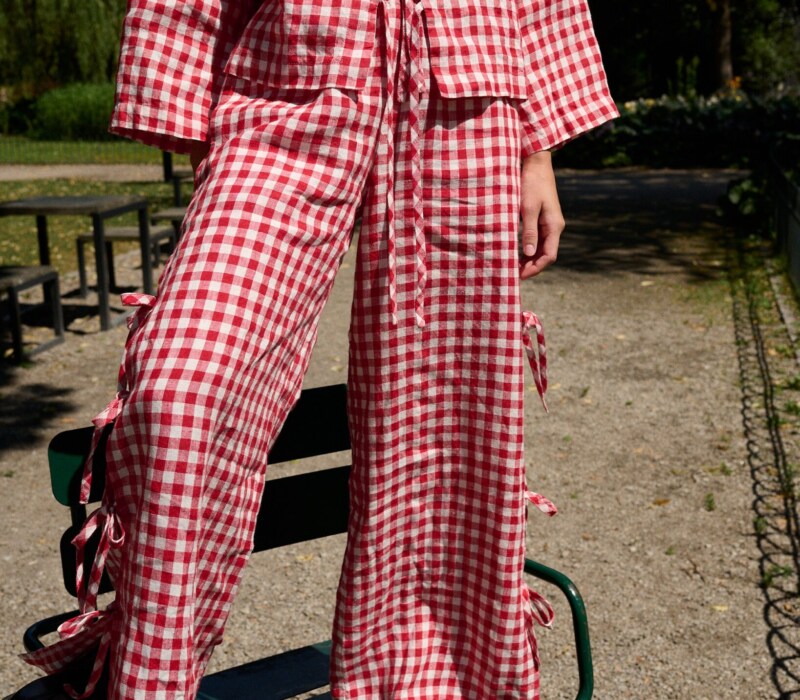 Red gingham wide leg pants with side ties and adjustable slit detail