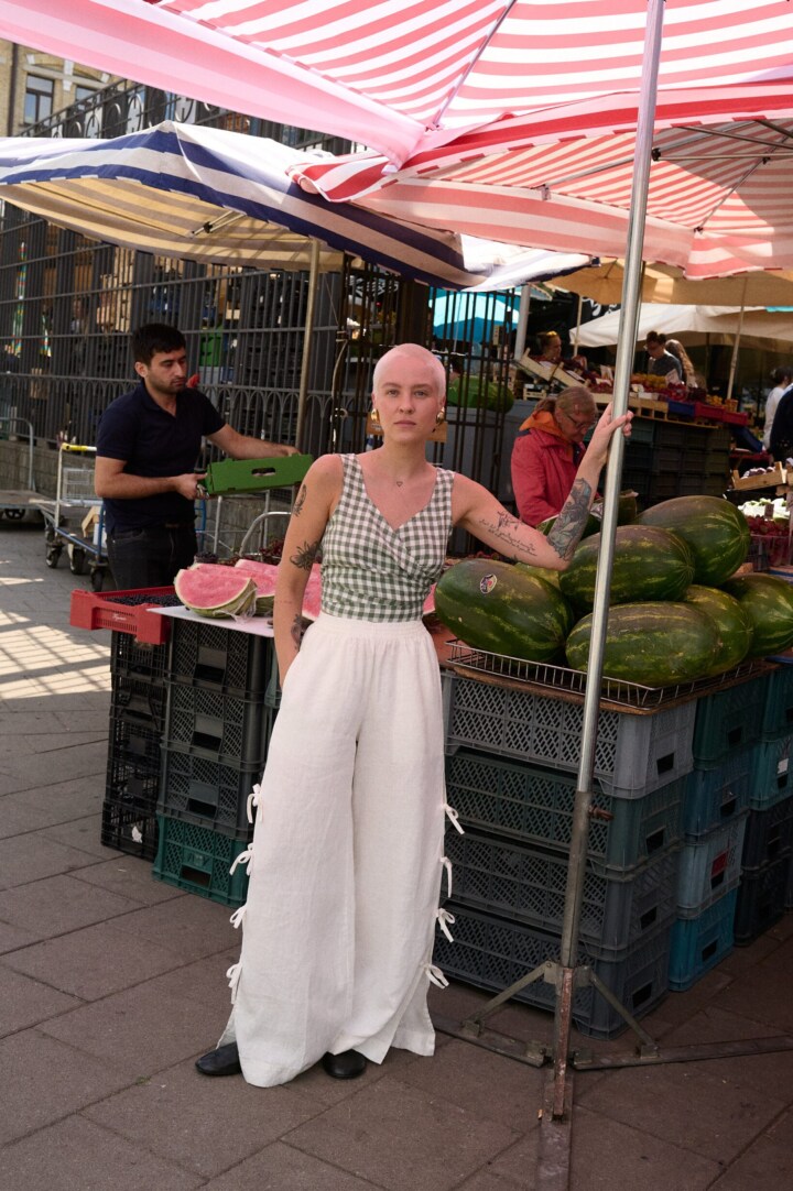 women is wearing white linen side tie pants