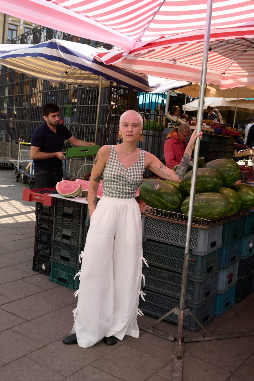 women is wearing white linen side tie pants