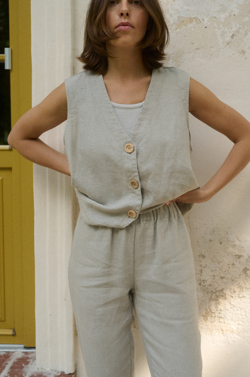 model is wearing linen vest in natural heavy linen