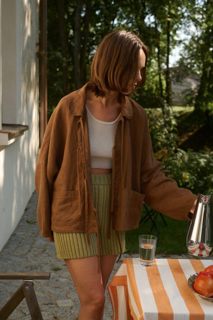 Linenfox model is wearing brown linen jacket