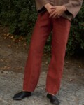 model is wearing tailored heavy linen trousers