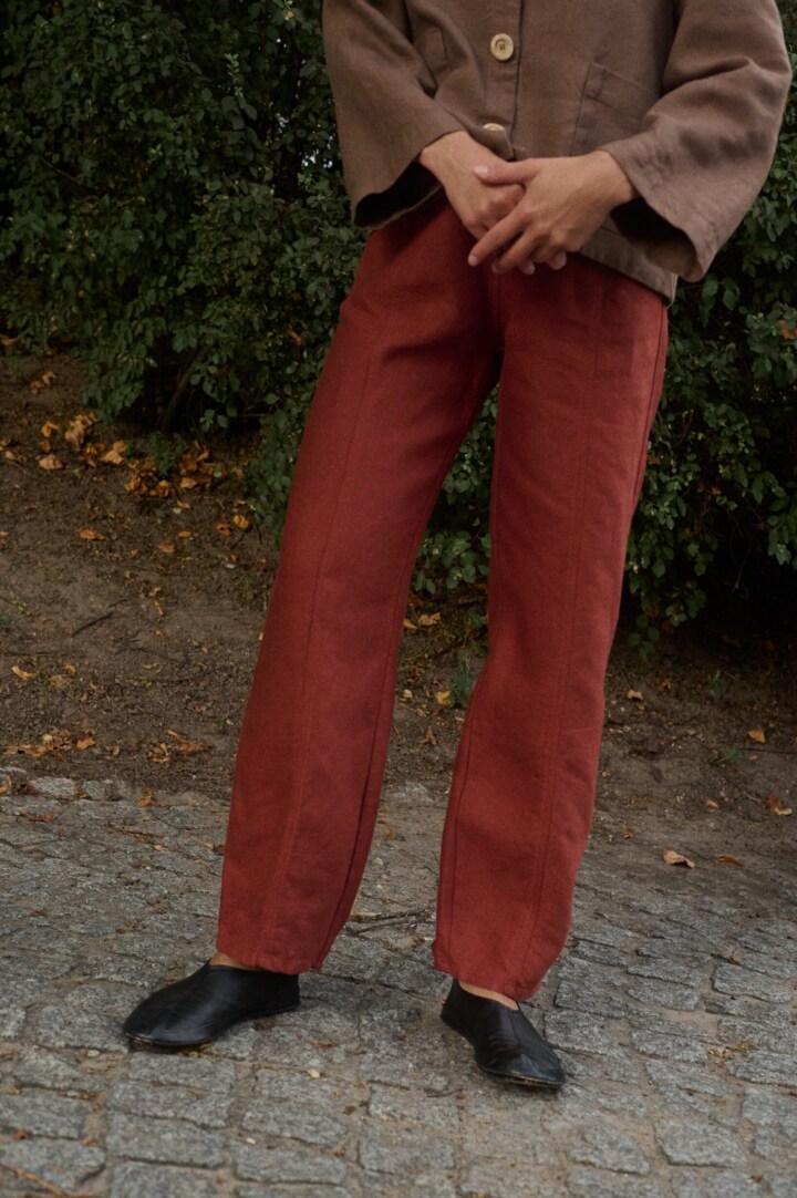 model is wearing tailored heavy linen trousers