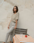 women is wearing tapered leg heavy linen pants