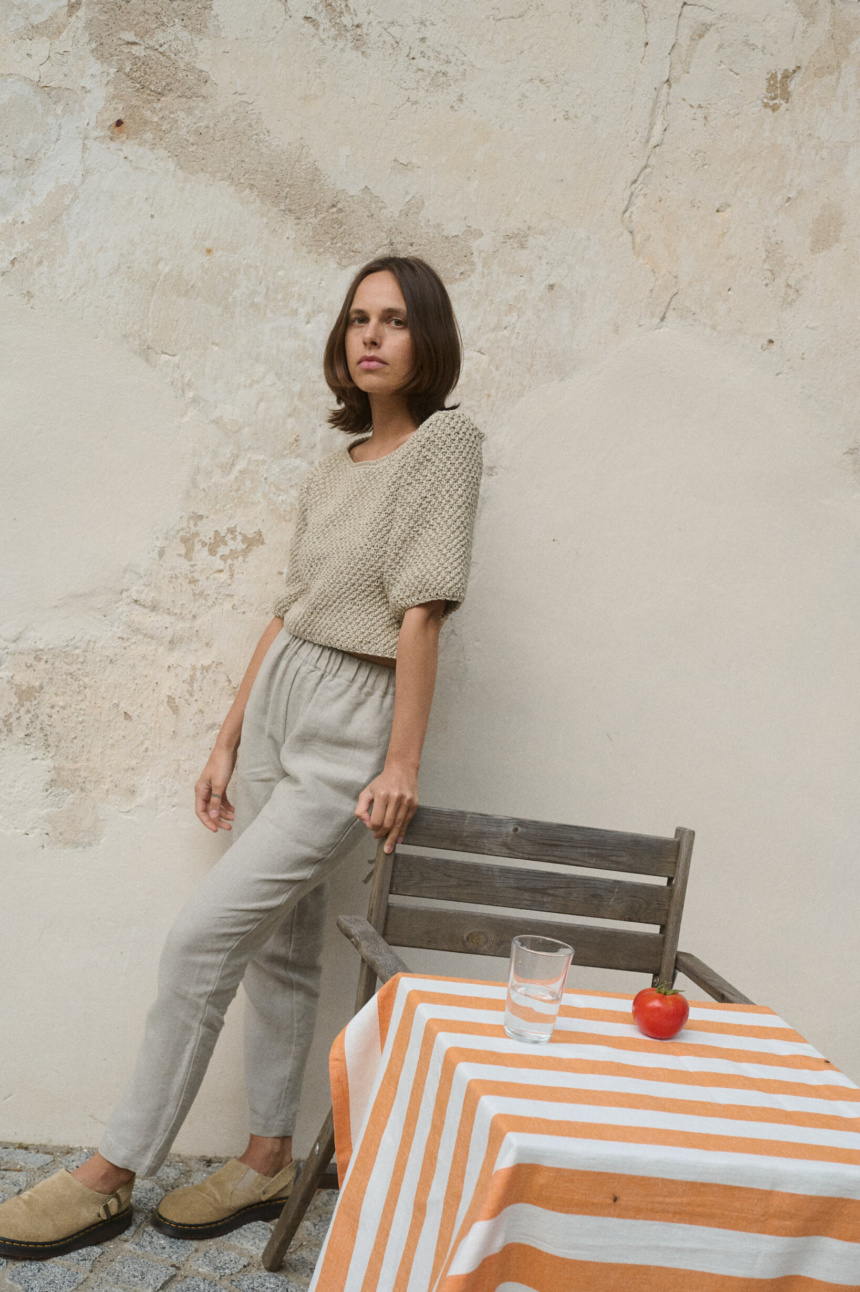 women is wearing tapered leg heavy linen pants