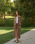model is wearing brown linen skirt