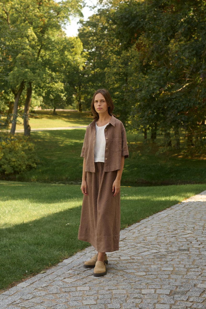 model is wearing brown linen skirt