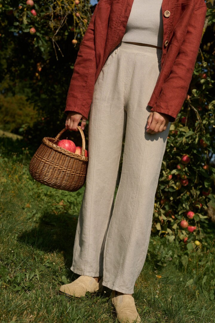 women is wearing a structured heavy linen trousers