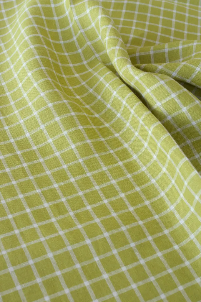close-up of natural pickle checks olive linen fabric