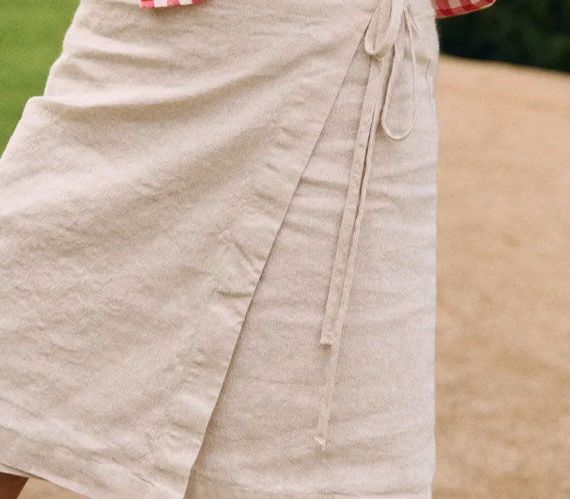 White cotton-linen blend mini wrap skirt with adjustable waist ties