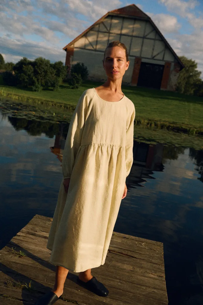 Apple checks linen midi dress with long sleeves and gathered waist styled outdoors