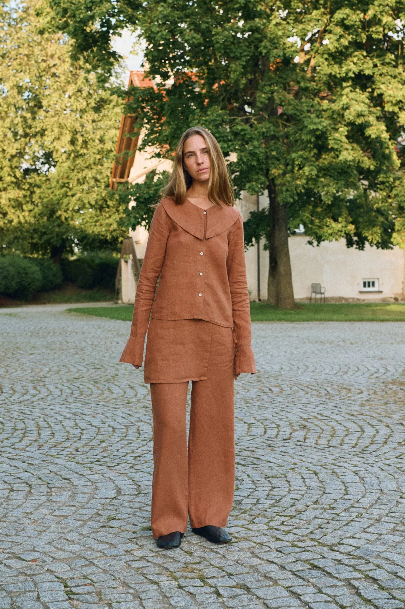 Full-length view of mocha mousse linen set with wrap panel detail at waist