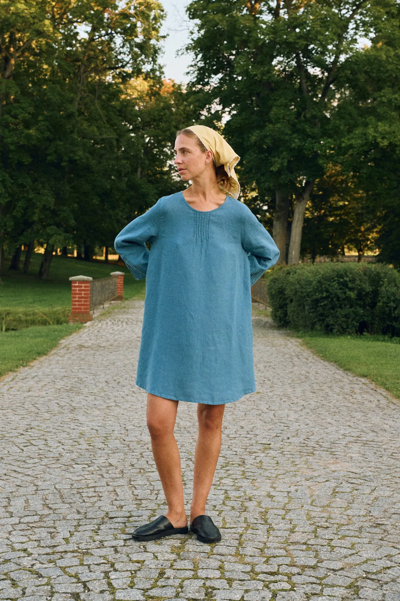 Stellar blue linen mini dress with oversized A-line shape and flared three-quarter sleeves styled with butter bandana headscarf