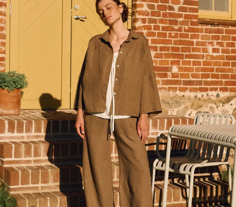 Cacao oversized linen shirt with shell buttons styled with matching high-waisted trousers