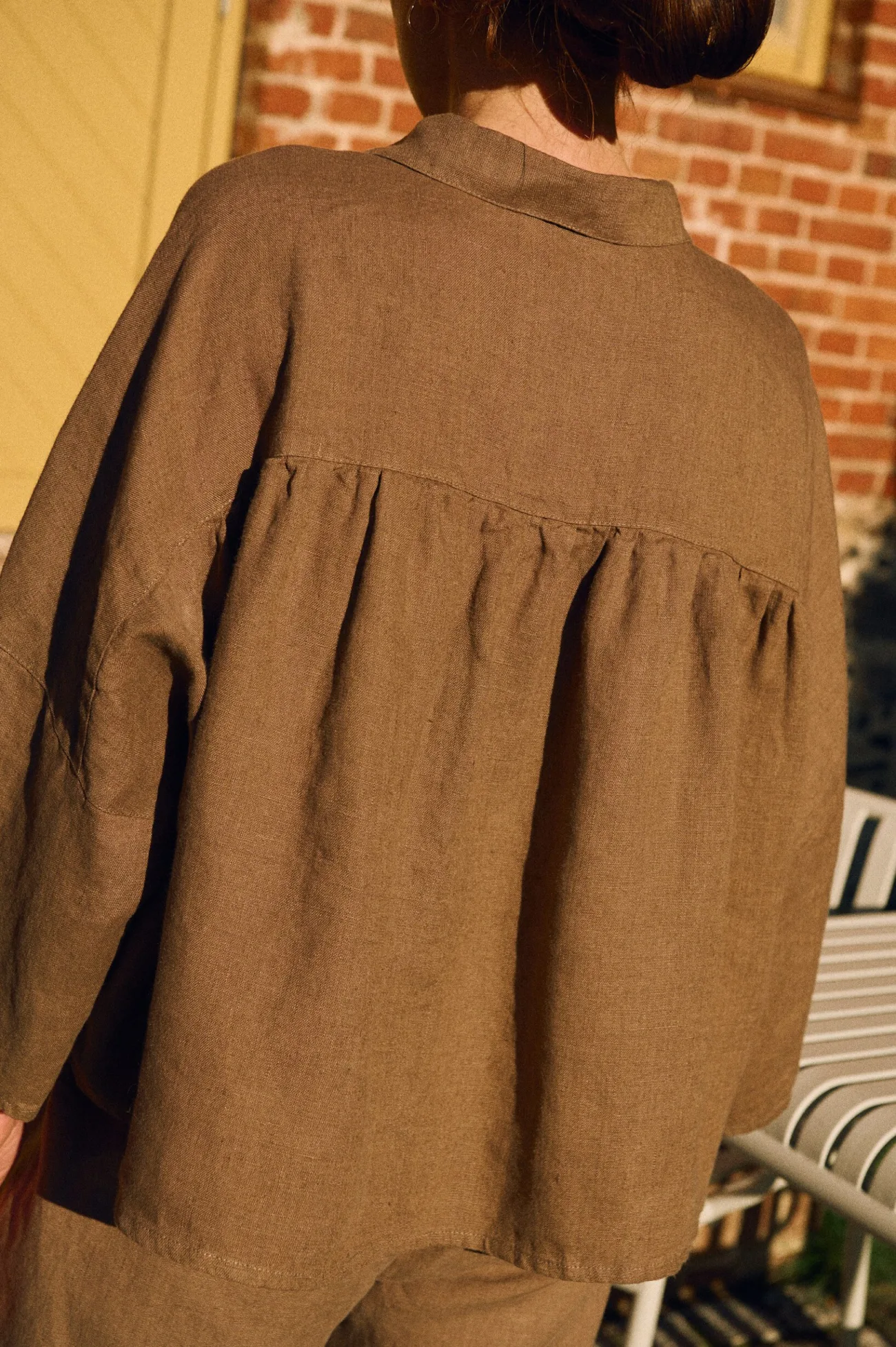 Back view of cacao oversized linen shirt with gathered back detailing