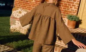 Cacao linen shirt with ruffled gathered back and relaxed oversized fit, back view