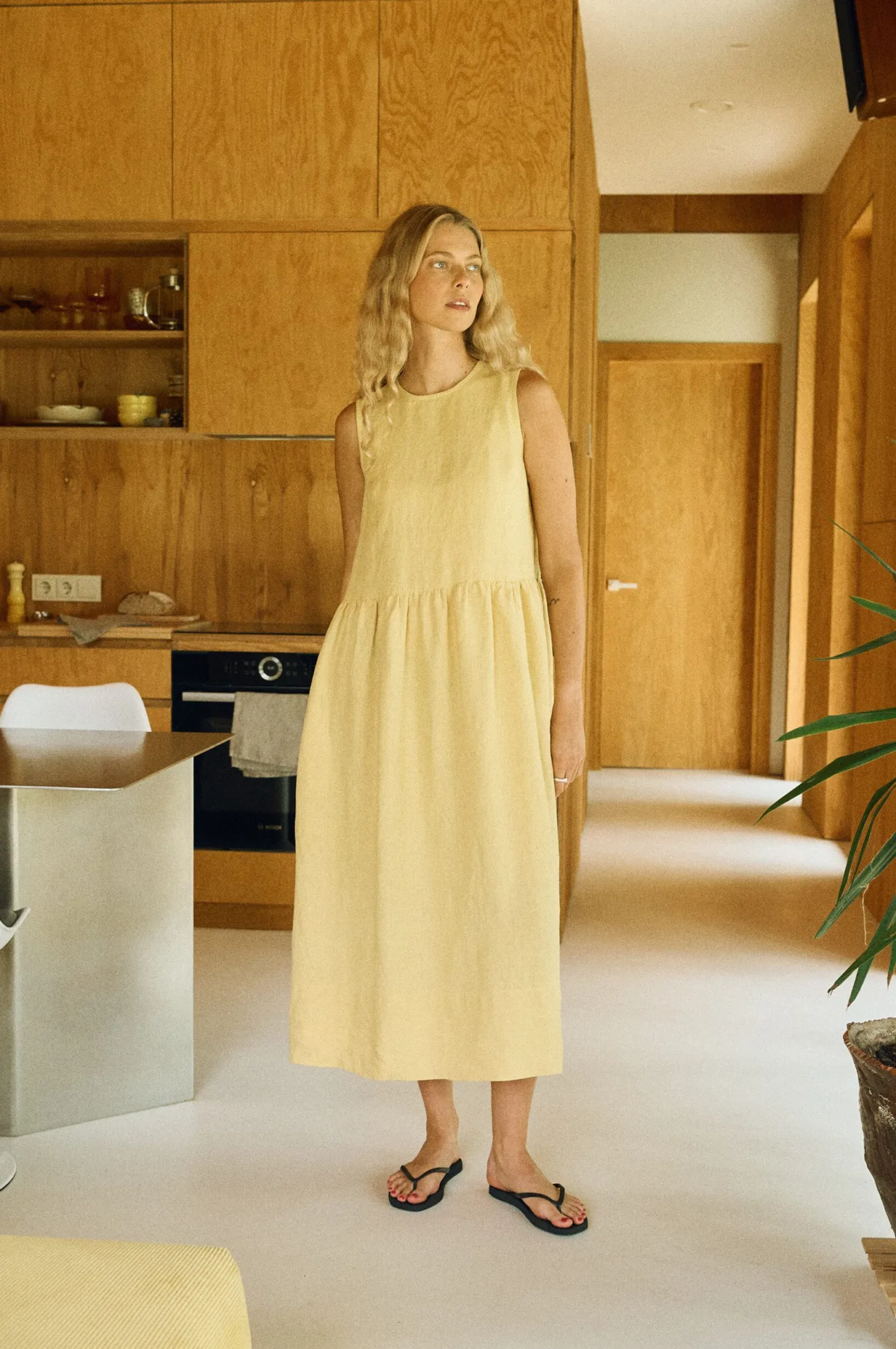Butter yellow linen sleeveless dress with gathered waist front view