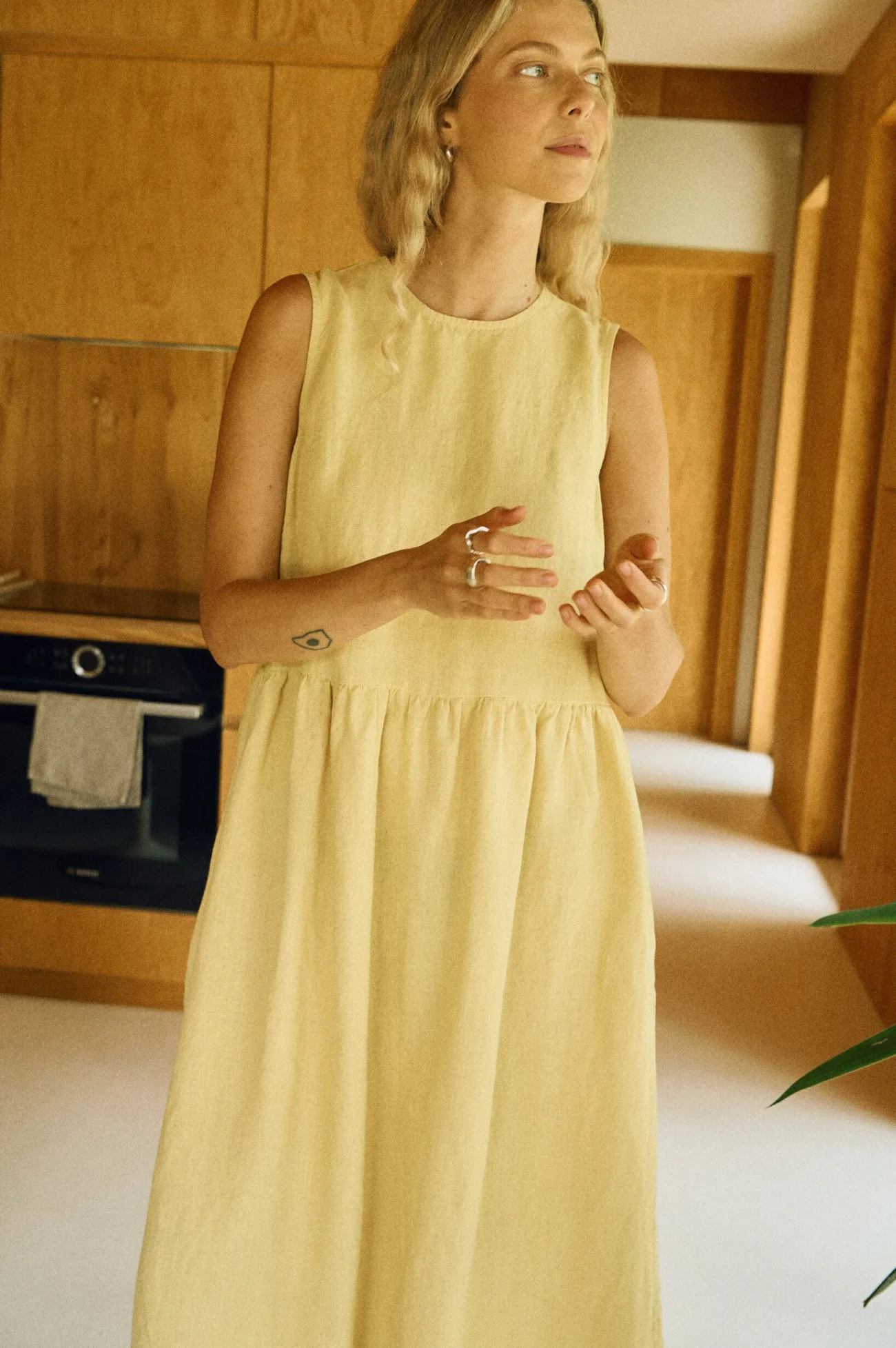 Butter linen midi dress with gathered waist and flowing skirt