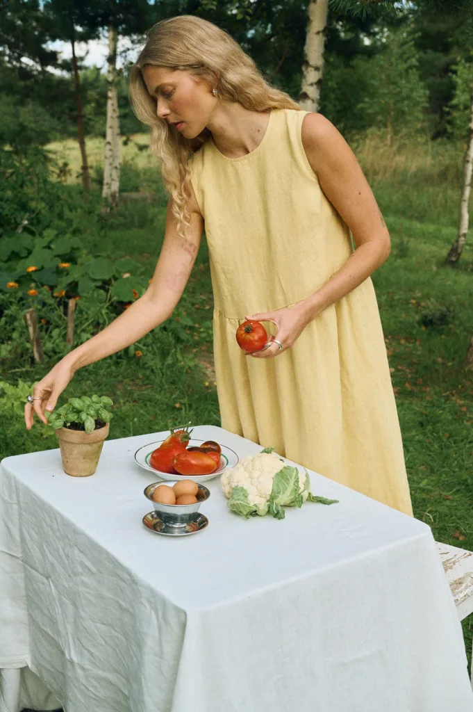 Butter linen midi dress with gathered waist and flowing skirt