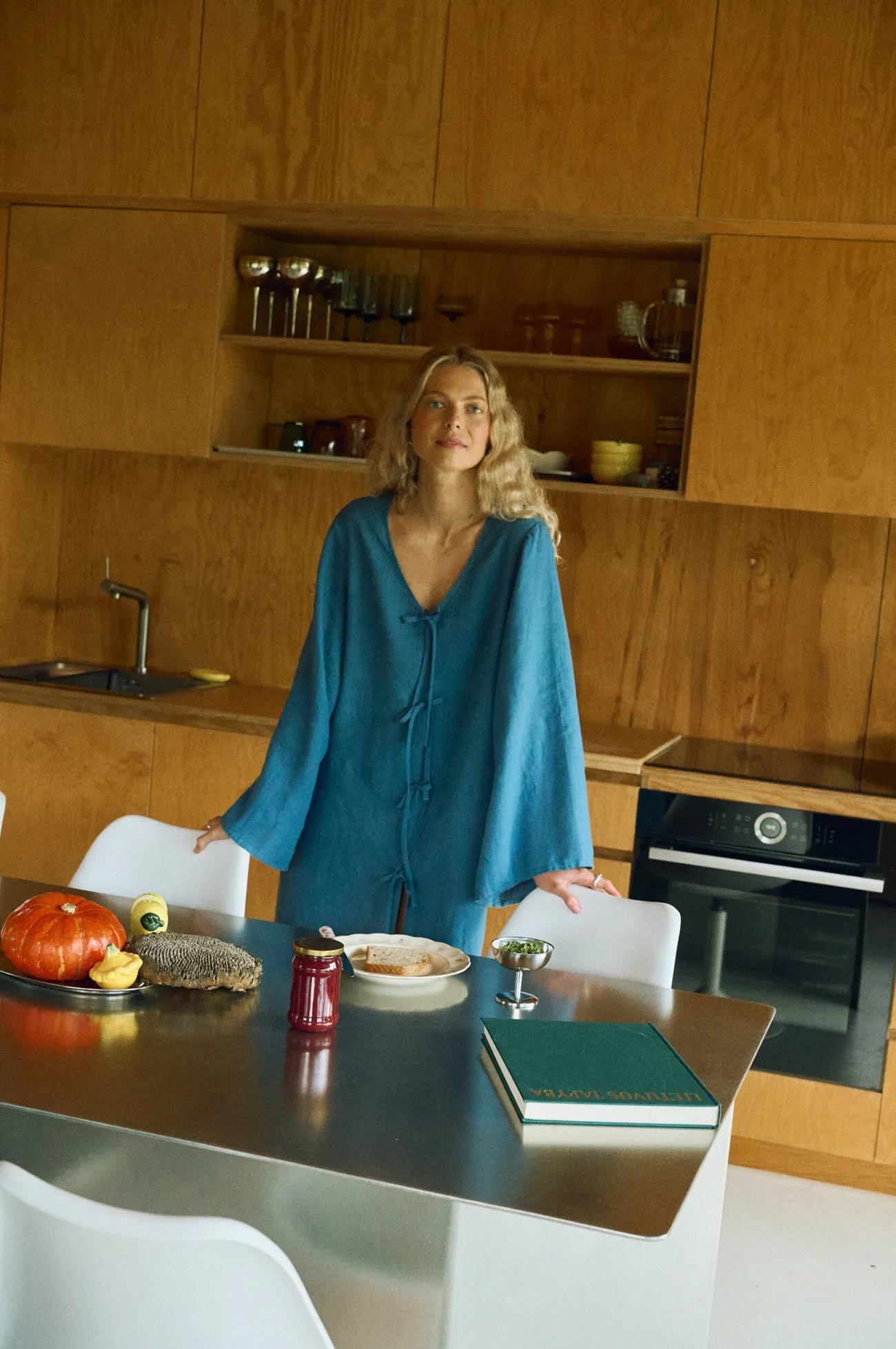 Oversized stellar blue linen mini dress with a deep V-neckline and front tie detail