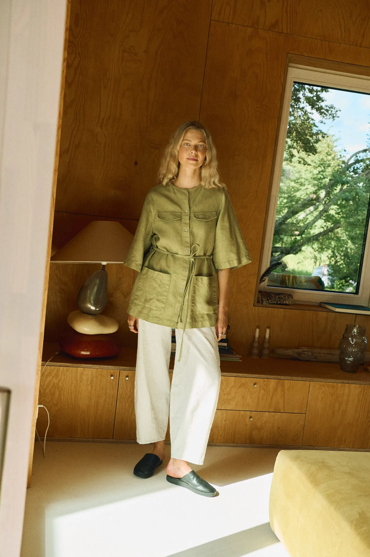Olive linen overshirt, relaxed fit, paired with natural cotton-linen trousers