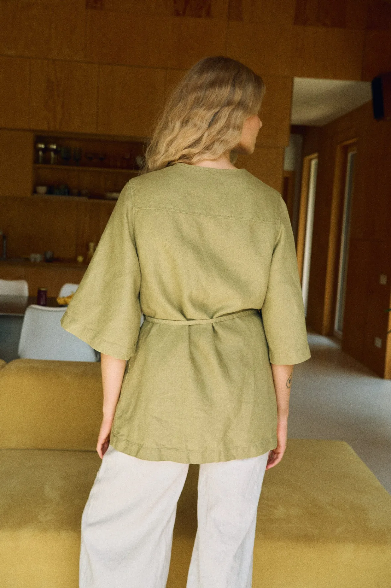 Relaxed-fit olive linen overshirt, back detail on model