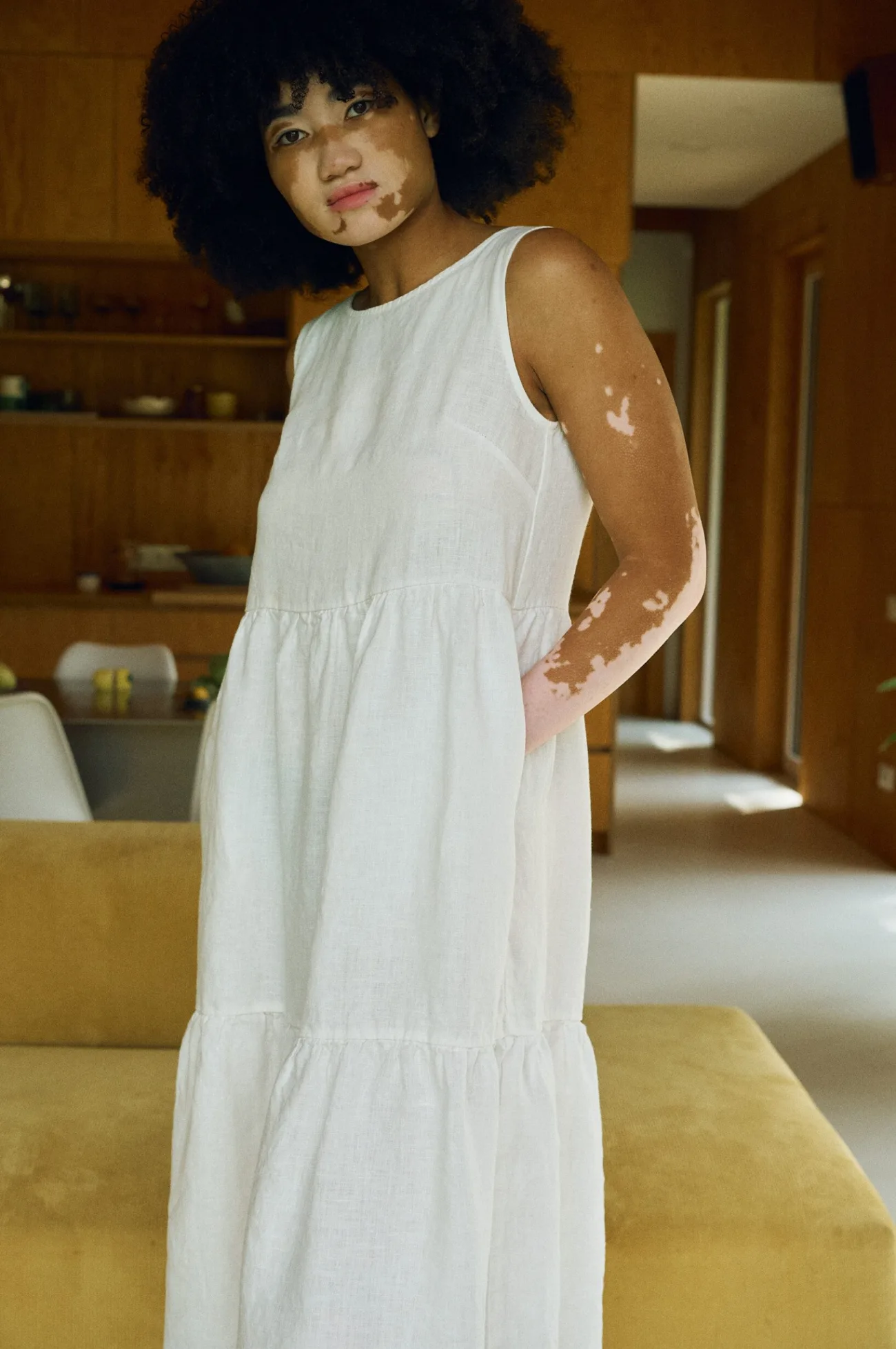 Amalie tiered linen midi dress in milky white, featuring a scoop neck and practical hidden pockets