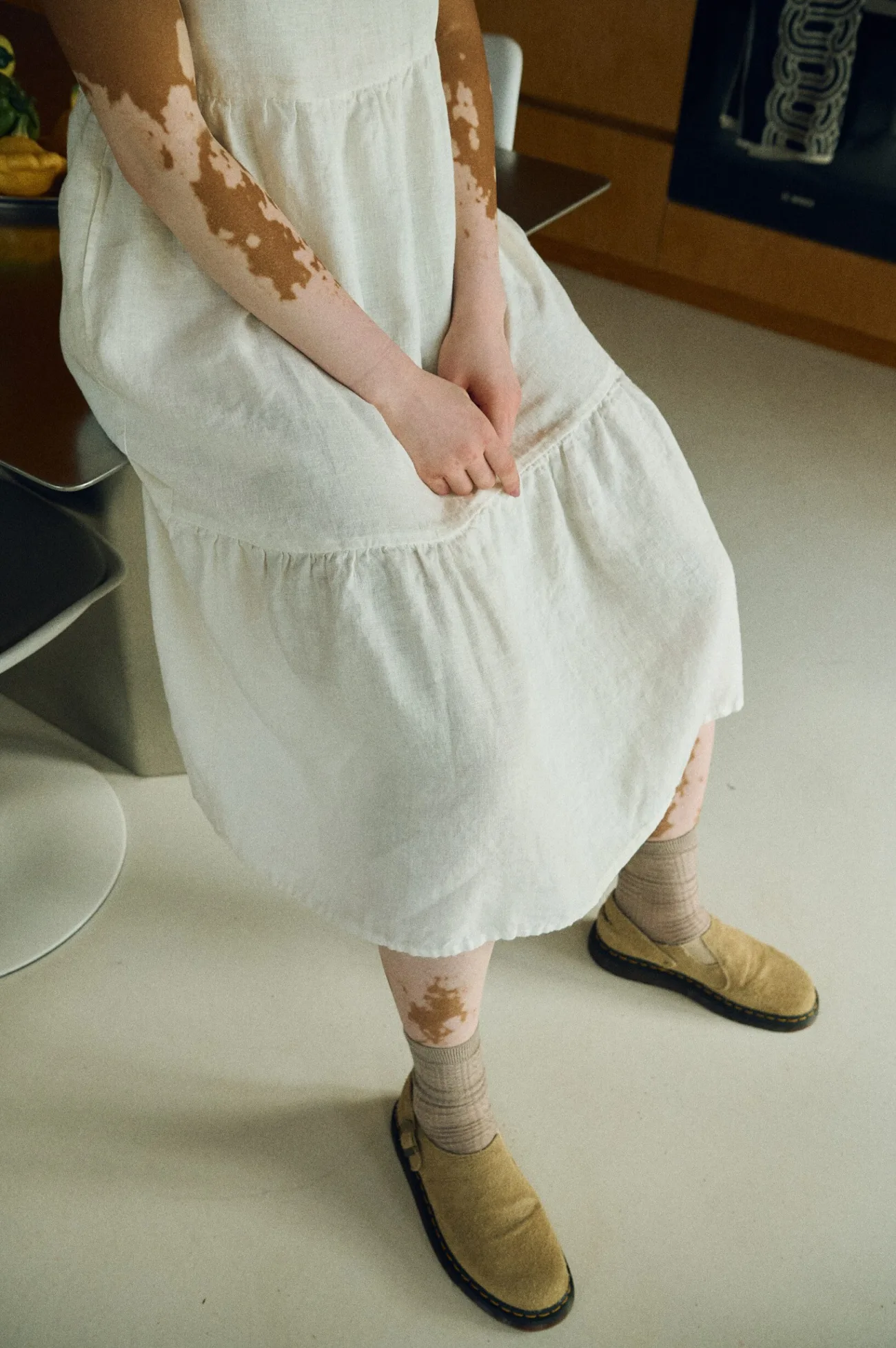 Tiered construction of the Amalie midi dress skirt in milky white linen