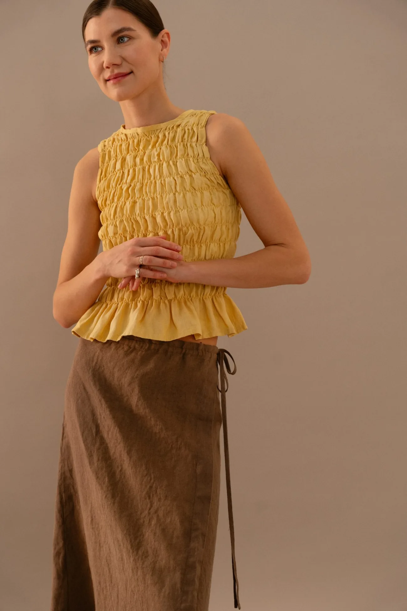 Yellow textured linen top styled with cacao brown wrap skirt featuring side tie detail