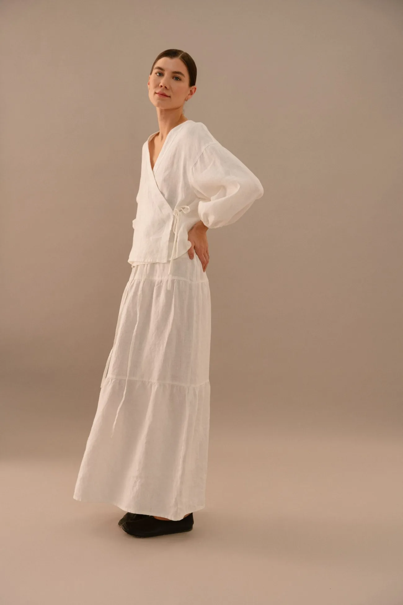 Milky white linen two piece set with wrap style top and tiered maxi skirt in relaxed silhouette