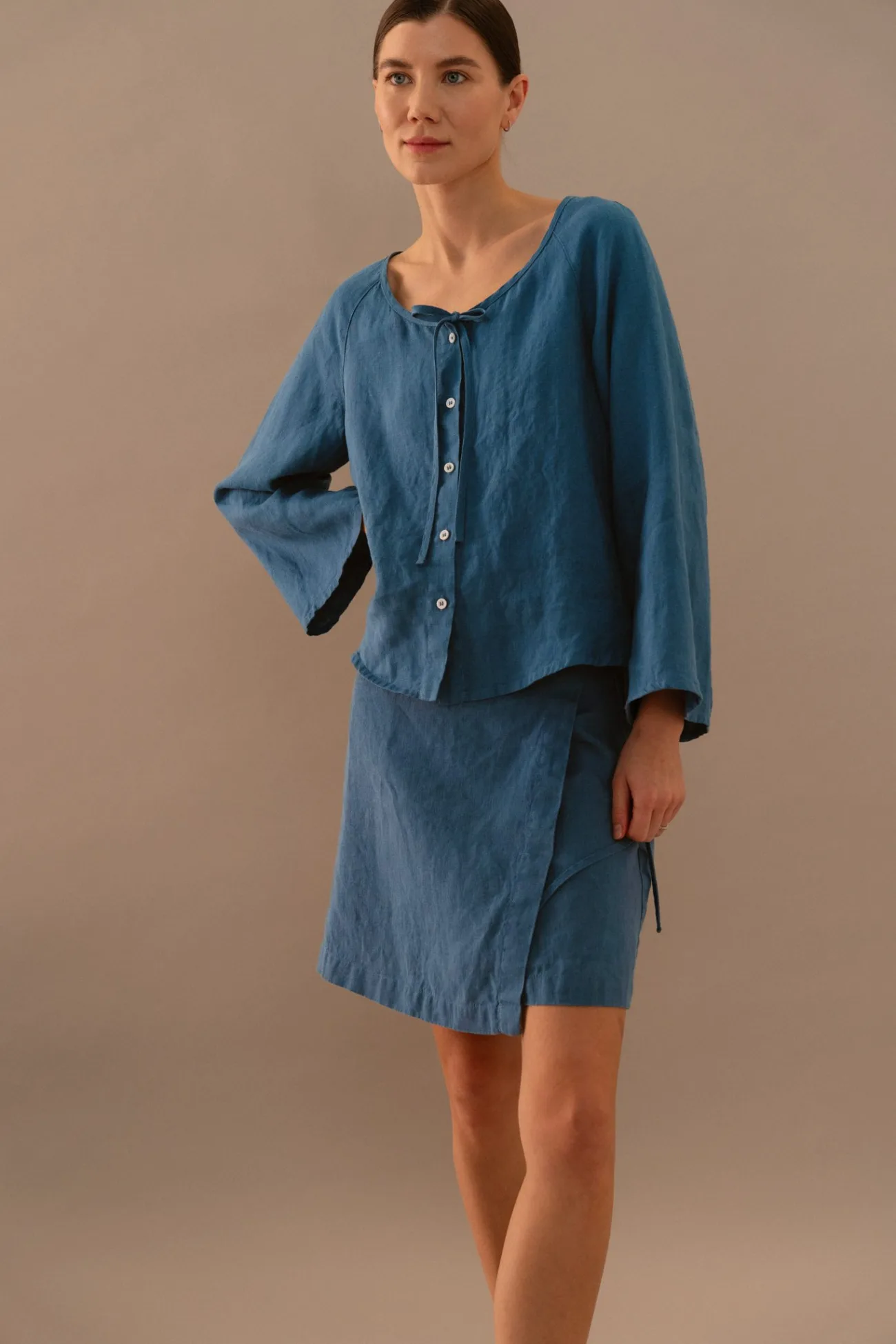 Stellar blue linen button-front blouse styled with matching wrap mini skirt